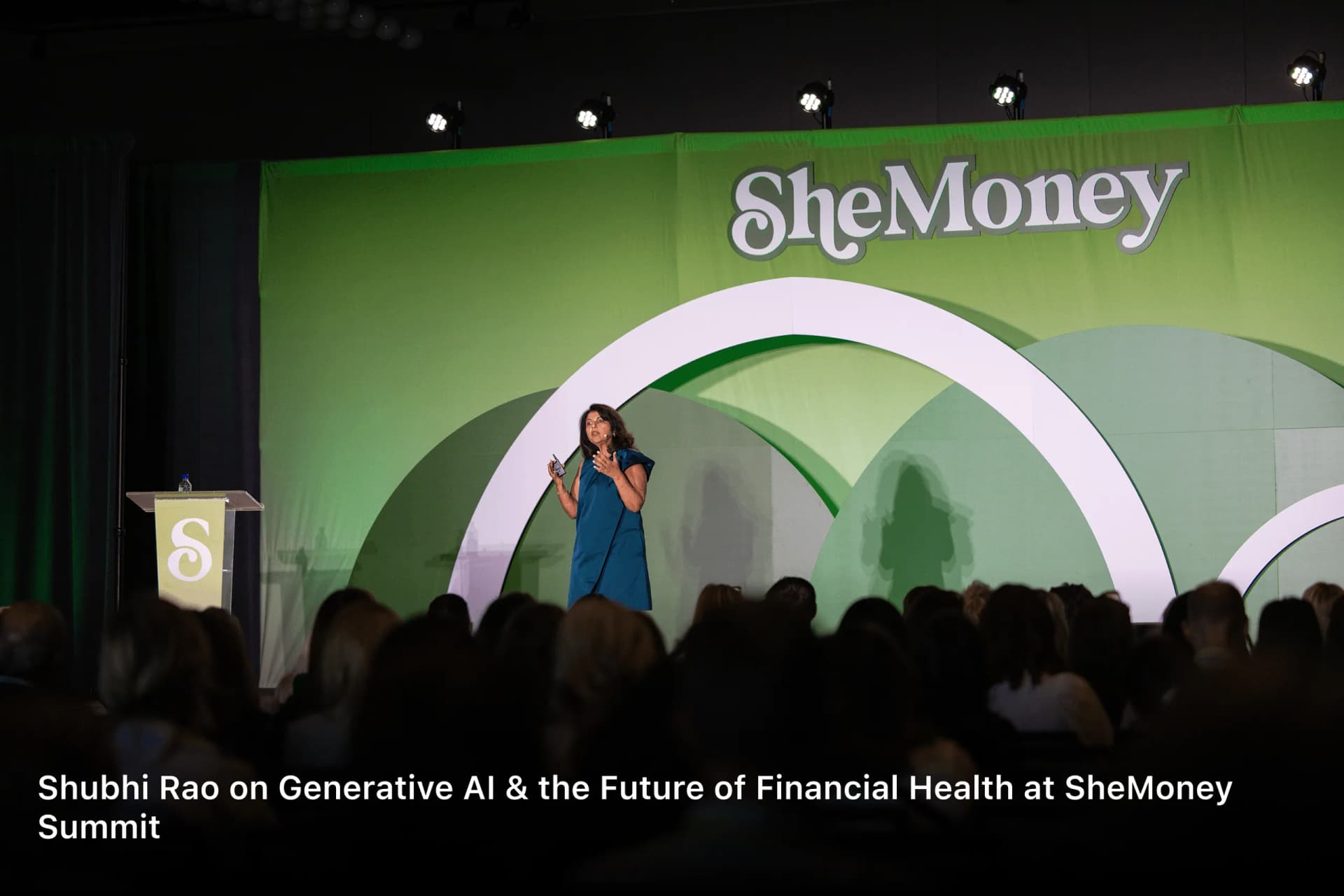 Shubhi Rao speaking on stage at the SheMoney Summit on generative AI and the future of financial health