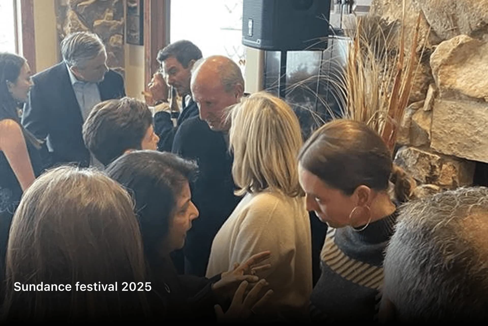 Guests leaning in to talk at a crowded Sundance Festival 2025 reception