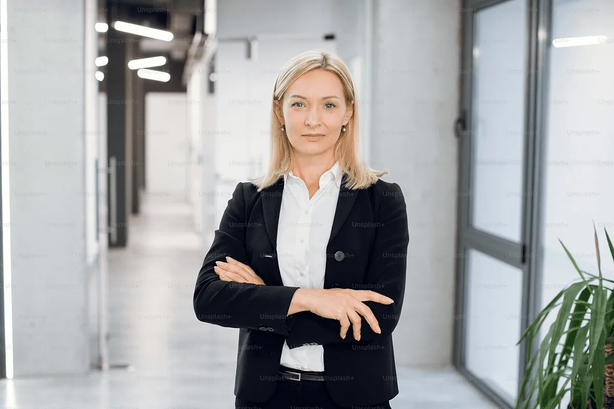UP member in a grey suit adjusting her glasses